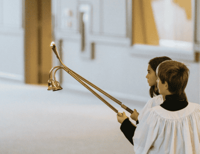 Acolytes carry in and carry out Jesus' light in Traditional Worship